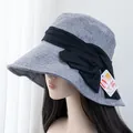 Detailed side view of grey sun hat with black bow and 99% UV protection tag - Adjustable / Blue Gray