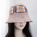 Detail of pink hand-crocheted straw bucket hat with colorful granny square floral patterns - Adjustable / Pink with Orange Flower