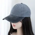 Close-up of vintage washed cotton baseball cap showing contrast brim and stitching - Grey With Black Brim