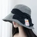 Detail of UV protection sun hat featuring a large elegant bow and breathable fabric - Adjustable / Green Gray