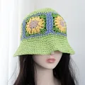 Detail of hand-woven green straw bucket hat with colorful crochet sunflower patterns - Adjustable / Green
