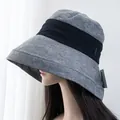 Detailed view of gray woven linen sun hat with black decorative ribbon and wide brim - Adjustable / Green Gray