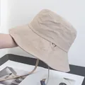 Detail view of beige sun hat featuring quilted stitching and adjustable windproof drawstring - Adjustable / Khaki