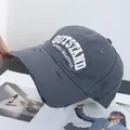 Detail of distressed brim and white 3D embroidery on a dark grey cotton baseball cap - Adjustable / Dark Gray