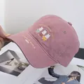 Detailed embroidery of cute cartoon bunnies on a dusty pink cotton baseball cap - Adjustable / Pink