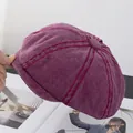 Close-up of retro burgundy newsboy cap with contrast stitching and corduroy texture - M(56-58cm) / Burgundy
