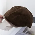 Detailed texture of dark brown corduroy baker boy hat with faux leather visor - Coffee