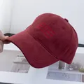 Detail of embroidered lettering on burgundy cotton baseball cap with curved visor - Adjustable / Burgundy