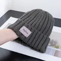 Detailed knit texture of dark grey ribbed beanie with YOUTIAN label and stretch view - Stretchy / Dark Gray
