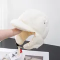 Detail of off-white padded aviator hat showing ear flaps and adjustable buckle strap - Adjustable / Off White