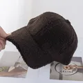 Detail shot of textured dark brown faux lamb wool fabric on a plush baseball cap - Adjustable / Coffee