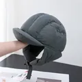Close-up of dark grey quilted trapper hat with ear flaps and adjustable chin strap - Adjustable / Gray