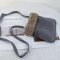Close-up of gray suede crossbody phone bag with brown faux shearling trim details - 22*25 / Gray