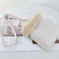 Detail of a creamy fleece shoulder bag with gold hardware on a stylish magazine background - 22*25 / Off White