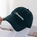 Detail of dark green cotton baseball cap with white Awesome embroidery and eyelets - Green