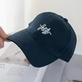 Detail of navy blue cotton baseball cap with white 3D embroidery and reinforced stitching - Navy Blue