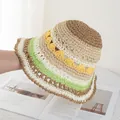 Detail of colorful hand-woven rainbow straw bucket hat with textured crochet pattern - Khaki and Beige