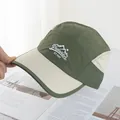 Close-up of olive green outdoor cap with mountain embroidery on quick-dry fabric - Adjustable / Army Green