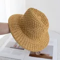 Detailed view of ginger yellow hollow straw hat with breathable weave for sun protection - Adjustable / Khaki