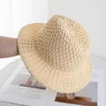 Detail of hollow woven straw Panama hat with breathable texture for summer beach sun protection - Adjustable / Beige