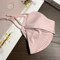 Detail of pink cooling ice silk mask with breathable mesh and adjustable ear loops - Pink