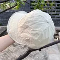 Detail of lightweight nylon sun hat showing water-resistant fabric and adjustable drawstring - Adjustable / Beige