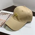 Detail of khaki cotton baseball cap with 3D yellow N embroidery on a magazine - Normal Circumference / Khaki