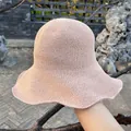 Detail of light pink hand-woven crochet sun hat with tight texture and wavy brim - Large Brim Style / Light Pink