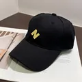 Detail of high-density cotton baseball cap with yellow 3D embroidered letter N - Normal Circumference / Black