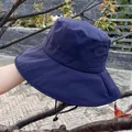 Detail view of navy blue sun hat with wide brim, air vents, and adjustable wind rope - Adjustable / Navy Blue