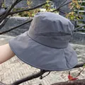 Detail of dark grey sun hat featuring wide brim, breathable eyelets and windproof strap - Adjustable / Gray