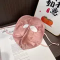 Detailed macro view of 100% mulberry silk sun mask with adjustable ear straps - Pink