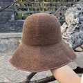 Detailed close-up of dark brown crochet texture on a handmade straw cloche sun hat - Large Brim Style / Dark Brown