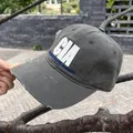 Detailed shot of distressed olive green baseball cap with white 3D CIA embroidery - Adjustable / Deep Olive Green