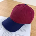 Detail of two-tone cotton twill baseball cap with burgundy crown and navy blue brim - Adjustable / Wine Red and Navy Blue Brim