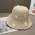 Detailed close-up of small daisy embroidery on a breathable beige woven straw sun hat - Adjustable / Beige
