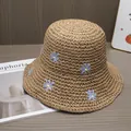 Close-up of handwoven straw sun hat with delicate daisy flower embroidery detail - Adjustable / Khaki