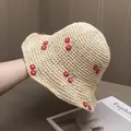 Detail of hand-woven straw hat featuring 3D embroidered cherries and fine crochet texture - Adjustable / Beige Hat Red Cherry
