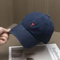 Detail of red heart and C letter embroidery on a navy blue twill cotton baseball cap - Adjustable / Navy Blue