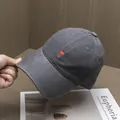 Close-up of red heart and C letter embroidery on a dark grey twill cotton baseball cap - Adjustable / Dark Gray