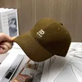 Detail of premium brown twill cotton baseball cap with 3D white ID letter embroidery - Coffee