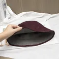 Detail view of burgundy faux suede bucket hat with black and white checkered lining - One Size (Reversible) / Burgundy