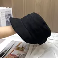 Detailed view of black suede flat-top baker boy hat featuring textured pleated layers - Adjustable / Black