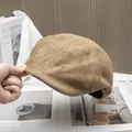 Detailed texture of camel faux suede beret hat with vintage matte finish and black lining - Adjustable / Khaki