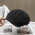Detail of premium black suede newsboy cap featuring vintage multi-panel stitching - Adjustable / Black