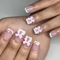 Faux ongles courts carrés roses style French avec nœuds 3D et finition brillante - Style Français Base Rose Bord Blanc Nœud 3D (YS021)