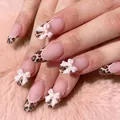 Faux ongles courts avec motif léopard et nœuds blancs 3D pour un look chic - Style Amande Léopard Café Nœud 3D (YS410)
