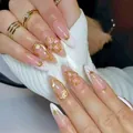 Long almond press-on nails with 3D pink flowers, gold French tips and star accents - YS633