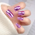 Macro shot of short metallic purple mirror effect press-on nails on a knit sweater background - Box Packaging / Lavender