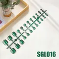Detailed view of dark green cat eye press-on toenails on wood tray with greenery - Dark Green Cat Eye Style (SGL016)